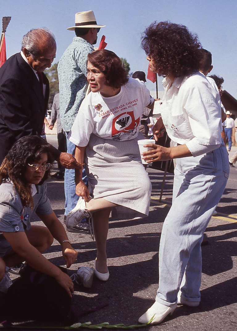 In this photo which has never been published until now, Dolores Huerta steps out of her dress shoes and into tennis shoes to participate in &quot;The Last March&quot; at the funeral of her United Farm Workers co-founder Cesar Chavez.